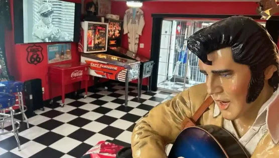 oval soda fountain-Formica table and a checkered tile floor